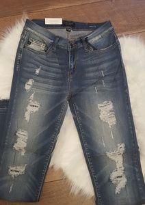 Ripped skinny jeans with frayed hems Judy Blue